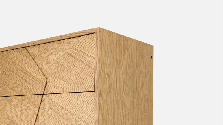 Chiffonnier ECLIPSE façades sculptées et piètement métal